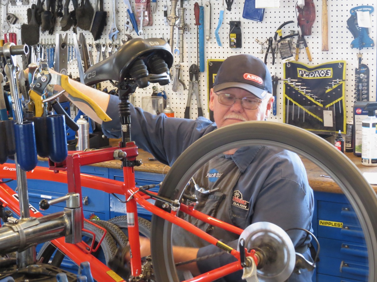 Pete McCreary repairing bike